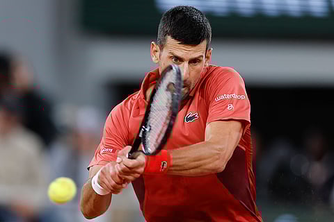 Djokovic plays a shot against Roberto Carballes Baena